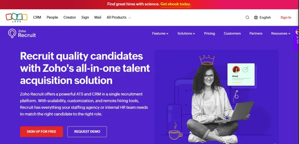 Zoho Recruit talent acquisition software hero banner showing smiling woman with crown illustration sitting cross-legged with laptop on vibrant purple background, with 'Hired' candidate card and coffee cup icons, headline reads 'Recruit quality candidates with Zoho's all-in-one talent acquisition solution